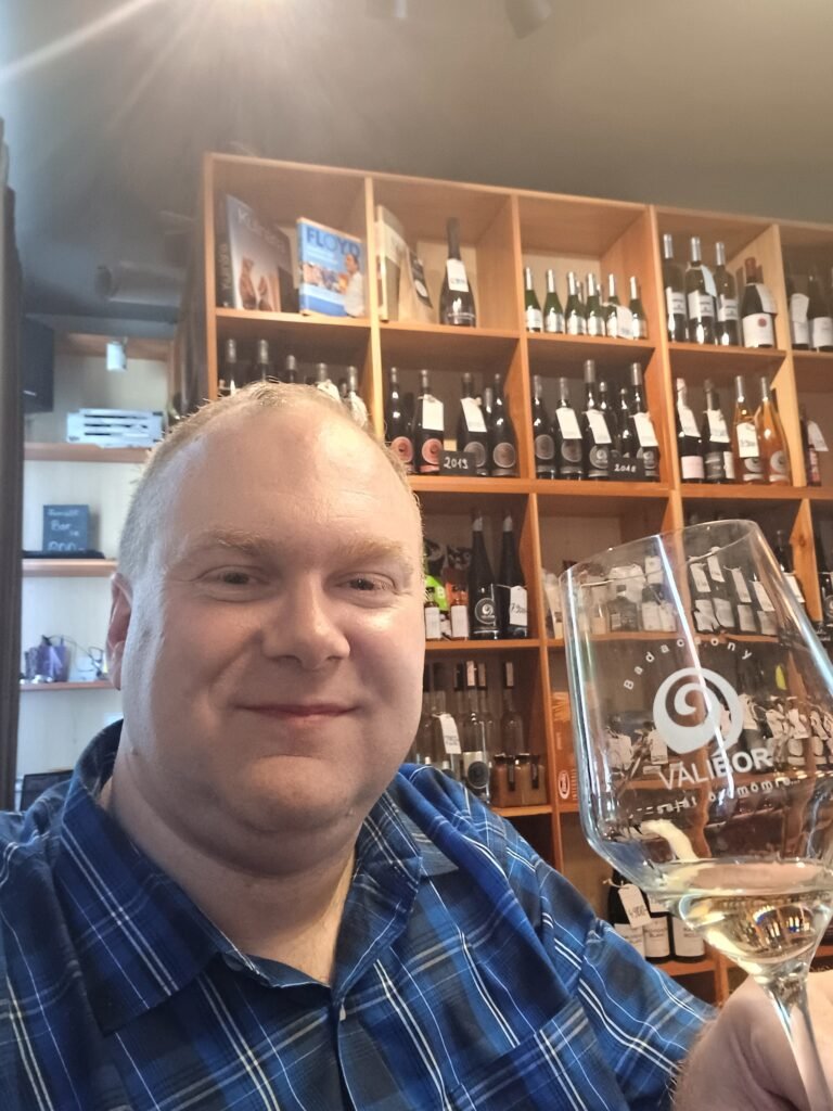 A picture of me drinking the Ottonel Muskotály wine at Valibor